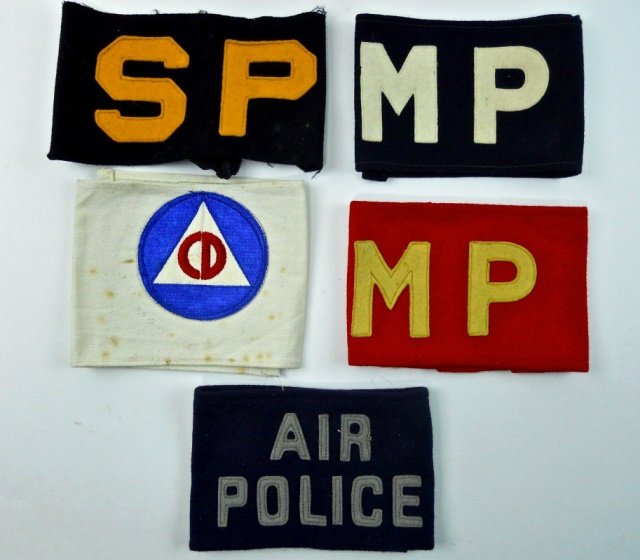 WWII Era U.S. Armbands, MP, SP, CD (5pc): Two wool with "MP" applique, one wool with "SP" applique. One with "AIR POLICE" applique. One in cotton with sewn "CD" patch, interior with name and dated 1942-43 in ink.