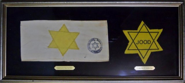 WWII Dutch JOOD Star Patch, Star of David Armband: Two items framed under glass, yellow material with screen printed Star of David with "JOOD" in center. White linen arm band with two piece sewn yellow Star of David, with circular ink stamp with Star