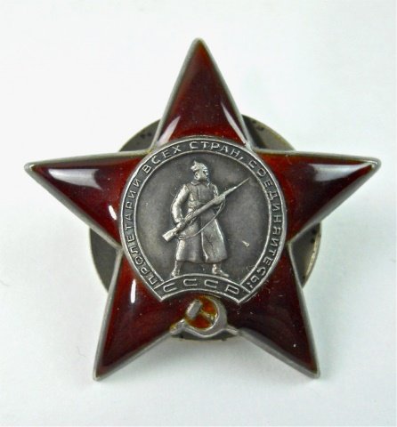 WWII Russian Order of the Red Star Badge: Die struck silver and enamel construction. Depicts Russian rifleman with Cyrillic writing and "CCCP" superimposed on red enamel star with hammer and sickle. Reverse with post and screw back. Hallmark 