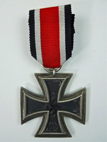 WWII German Iron Cross, 2nd Klasse, 24: Three piece die struck alloy and iron with center canted swastika over 1939 date. Reverse with 1813 suspension ring marked "24" with ribbed black, white and red ribbon. 1.8" H x 1.8" W