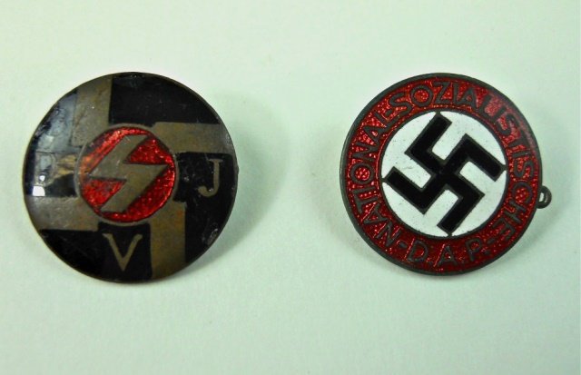 Two WWII German Nazi Pins, DAP and DJV: One enamel on metal reads, "NATIONAL-SOZIALISTICHE D.A.B." with canted swastika on white medallion. Reverse "GES GESCH RZM M 1/78." One enamel on metal with sig rune in red medallion with "DJV". Rever