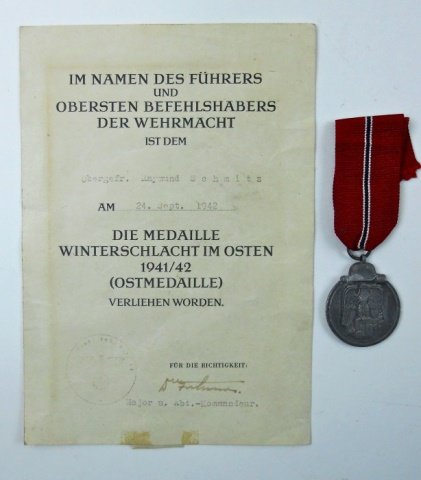 WWII German Russian Front Medal, Award Document: Die struck alloy, depicts Wehrmacht style eagle clutching swastika surmounted by German helmet and stick grenade. Reverse reads, "WINTERSCHLACHT IM OSTEN 1941/42" with sword and laurel. Suspension rin