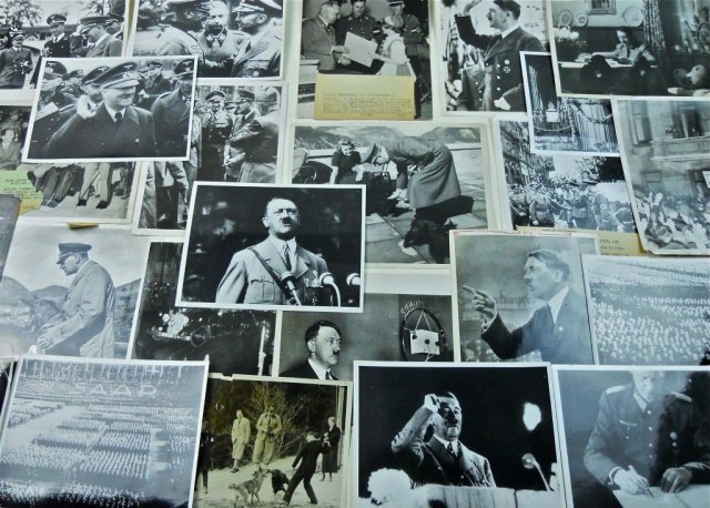 WWII Press Photos: Hitler and Nazi Party (52): Fifty-two 6.5 x 8.5 to 8 x 10 black and white glossy images depict Adolf Hitler and various Nazi party and war related subjects. Some carry paper paper descriptions, others carry ink stamps on reverse
