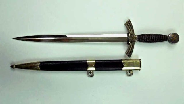 WWII First Model Luftwaffe Dagger - Carl Eichhorn: Silvered nickel mounts with wire wrapped Moroccan leather grip. Gilt swastika on pommel and cross guard. Blade with etched maker mark, "Original Eickhorn Solingen" with squirrel logo. Blade appears to