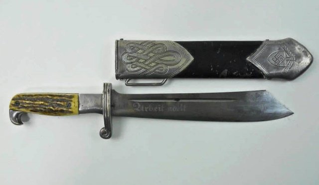 WWII German RAD Enlisted Hewer,Carl Eickhorn: Stag grip with nickel fittings. Blade etched, "Arbeit adelt" and on reverse, "Carl Eickhorn Solingen" with logo of squirrel in double oval and "GES. GESCH, RADL" in triangle. Ferule is numbered "MA 23