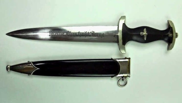 WWII SS Enlisted Dagger - Robert Klaas: Solid nickel guards with "I" group mark. Black wood grip with inset spread eagle and enamel SS rune button. Blade etched, "Meine Uhre heist Treve", reverse carries maker mark, "Robert Klaas Solingen" 