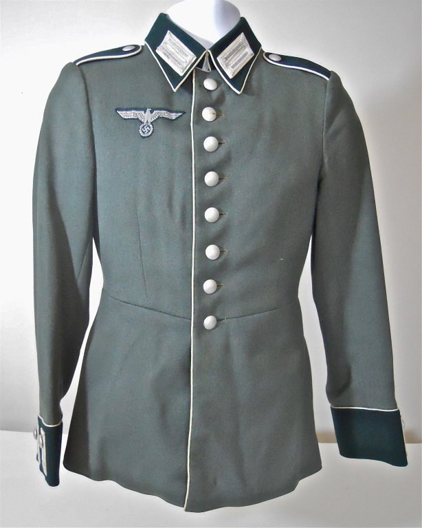 WWII German Infantry Parade Tunic: Quality gray wool construction, eight button front closure with hooked collar. Bullion collar insignia and sewn shoulder boards with white piping, bullion cuffs. Bullion chest eagle and six pebbled bu