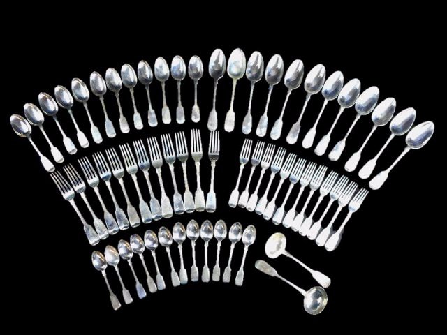 19th C. English Sterling Flatware Set, G. W. Adams: Sixty-two piece service for twelve in "Fiddle" pattern, carrying hallmark of George William Adams, London, with date letters from 1858-1865. Two ladles carry hallmark of John Whiting, with 1845 date l