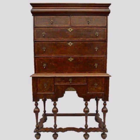 18th C. William & Mary Burl Highboy: William & Mary Two Piece Highboy, top with six drawers, two over three with top mold drawer, base having three drawers. Front in burl veneer with Herringbone border. Gothic arch apron over carved balu