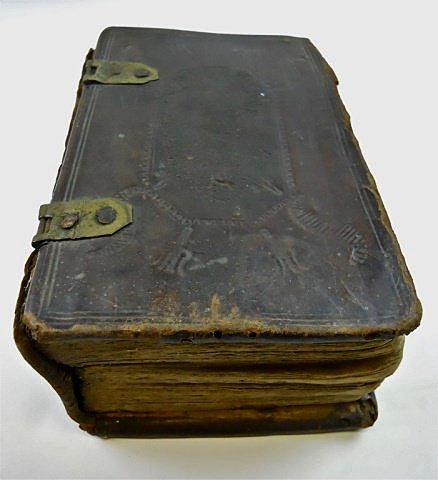 17th C. German Lutheran Bible with Illustrations: Leather bound bible with gothic font print in German. Profuse woodblock illustrations with tooled leather cover and spine. Covers are unattached, title page missing, age tone tears and edge wear from 