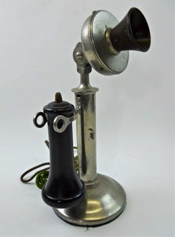 Antique Candlestick Telephone, Circa 1910: Nickel plated candlestick telephone with Bakelite speaker, original cloth wrapped cord. Manufacturer unknown. Measures 12" H