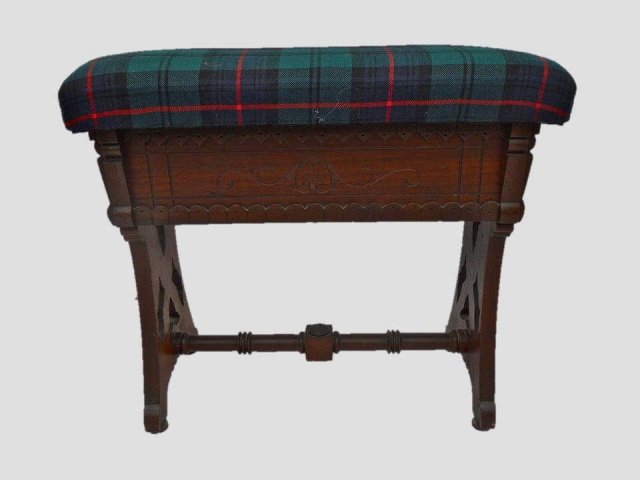 Eatlake Carved Walnut Upholstered Piano Stool: Carved walnut stool with Eastlake incuse decoration. Flip top with compartment, upholstered in wool Black Watch plaid.