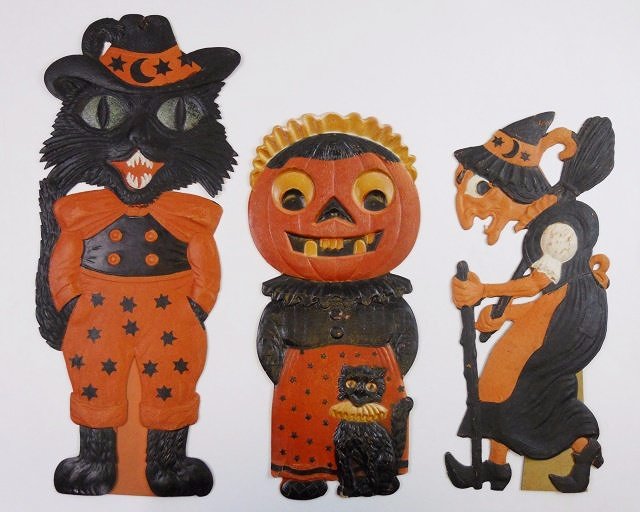 Vintage German Die Cut Halloween Decorations (3): Three vintage German embossed die cut cardboard Halloween decorations, circa 1920's - 1930's. Cat and witch are both standing items. Small tear at bottom left hem of dress on female JOL. Largest measu
