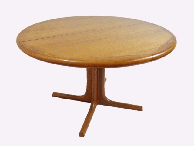 Danish Teak Table, Edward Valentinsen: Vintage Danish teak table designed by Edward Valentinsen for Dyrlund. Maker label affixed to bottom. Table measures 29" H x 47" in diameter, plus two 20" W leaves, 87" extended.