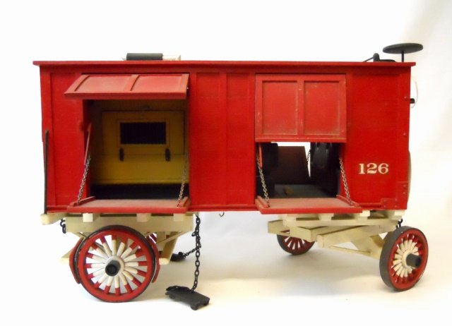Vintage Model Circus Wagon: Hand crafted and painted model #126 circus wagon, constructed of wood. Measures approximately 9" H x 14" W x 6.5" D.