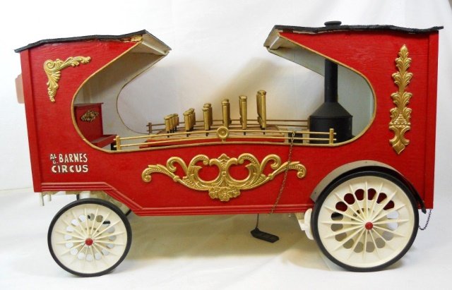 LG-Vintage Al G. Barnes Model Circus Wagon: Large hand crafted and painted model #13 circus pipe organ wagon, of wood construction with plastic wheels. Area of wood loss under roof at corner. Measures approximately 21" H x 44" W x 13" D.