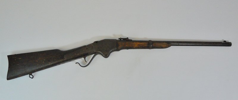 Civil War M1860 Spencer Carbine: Lever action Model 1860 military carbine. Walnut stock with sling swivel. Steel barrel with fixed sight and adjustable flip sight. Receiver stamped "56474". Block functions, missing hammer, three side