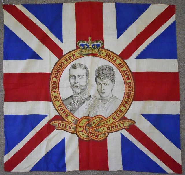 British Souvenir Wedding Banner, Circa 1893: Antique linen banner commemorating the wedding of HRH George, Duke of York and HSH Princess May of Teck. Central medallion depicts printed image of the royal couple. Circa 1893. Age tone to fabric. Me
