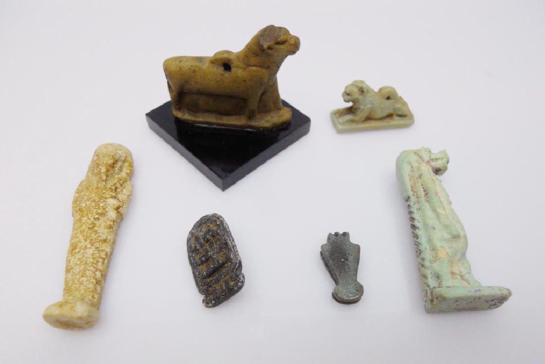 Ancient Egyptian Faience Amulets (7pc): Seven ancient Egyptian faience amulets: Menat, circa 712-30 B.C., measures .25" H, Lion, circa 712-30 B.C., measures 1" in length, Cartouche shaped amulet inscribed, "Amun, Lord of the Two Lands", dat