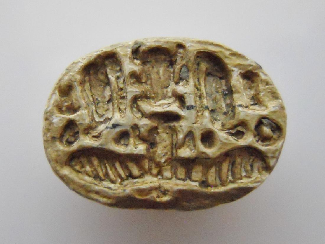 Egyptian Steatite Scarab, Amenhotep II, 18th DYN: Ancient white steatite scarab of Amenhotep II, the seventh Pharaoh of the eighteenth dynasty of Egypt. Incised details to underside. Circa 1450-1425 B.C. Measures 5/8" in length. PROVENANCE: From priv