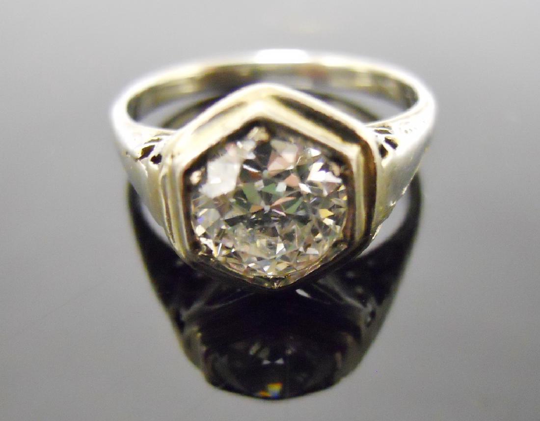 Ladies Platinum Diamond Solitaire Ring, 1.10 cts: Platinum filigree ring with bezel set diamond, evaluated as 1.10 cts, I color and IS1 Clarity. Ring measures size 6, total weight 2.7 g.
