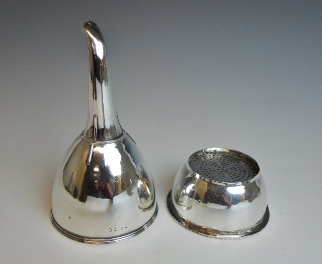 English Georgian Sterling Wine Filter, 1808: Antique British sterling silver wine decanter filter in two parts. Filter portion carries King George III duty mark and Lion Passant Guardant quality mark. Spout carries London city mark and 1808 date
