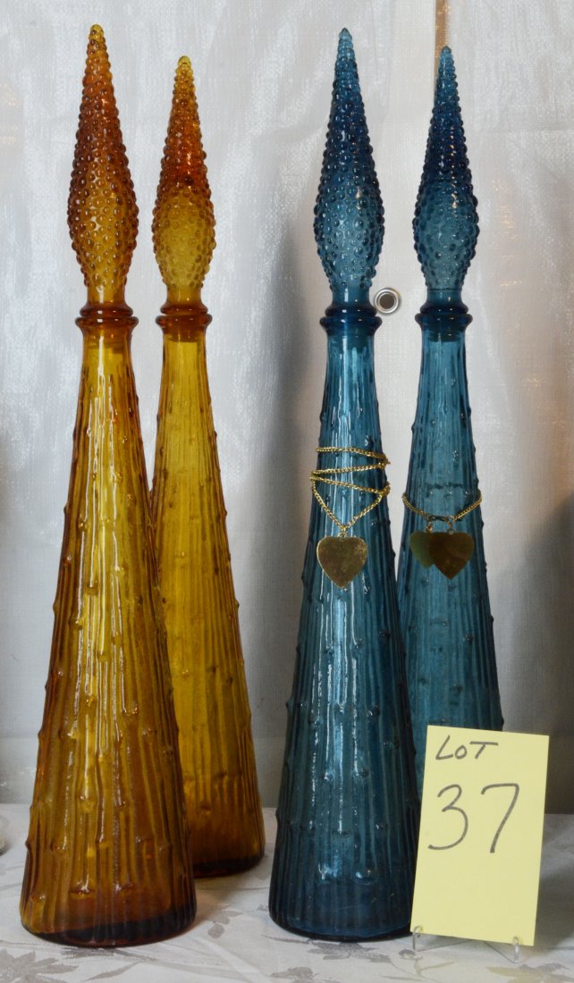 4 Mid Century Glass Tall Bottles Genie Bottles: 2 gold bottles and 2 blue bottles - all with stoppersThey are 22" tall with stoppers.
