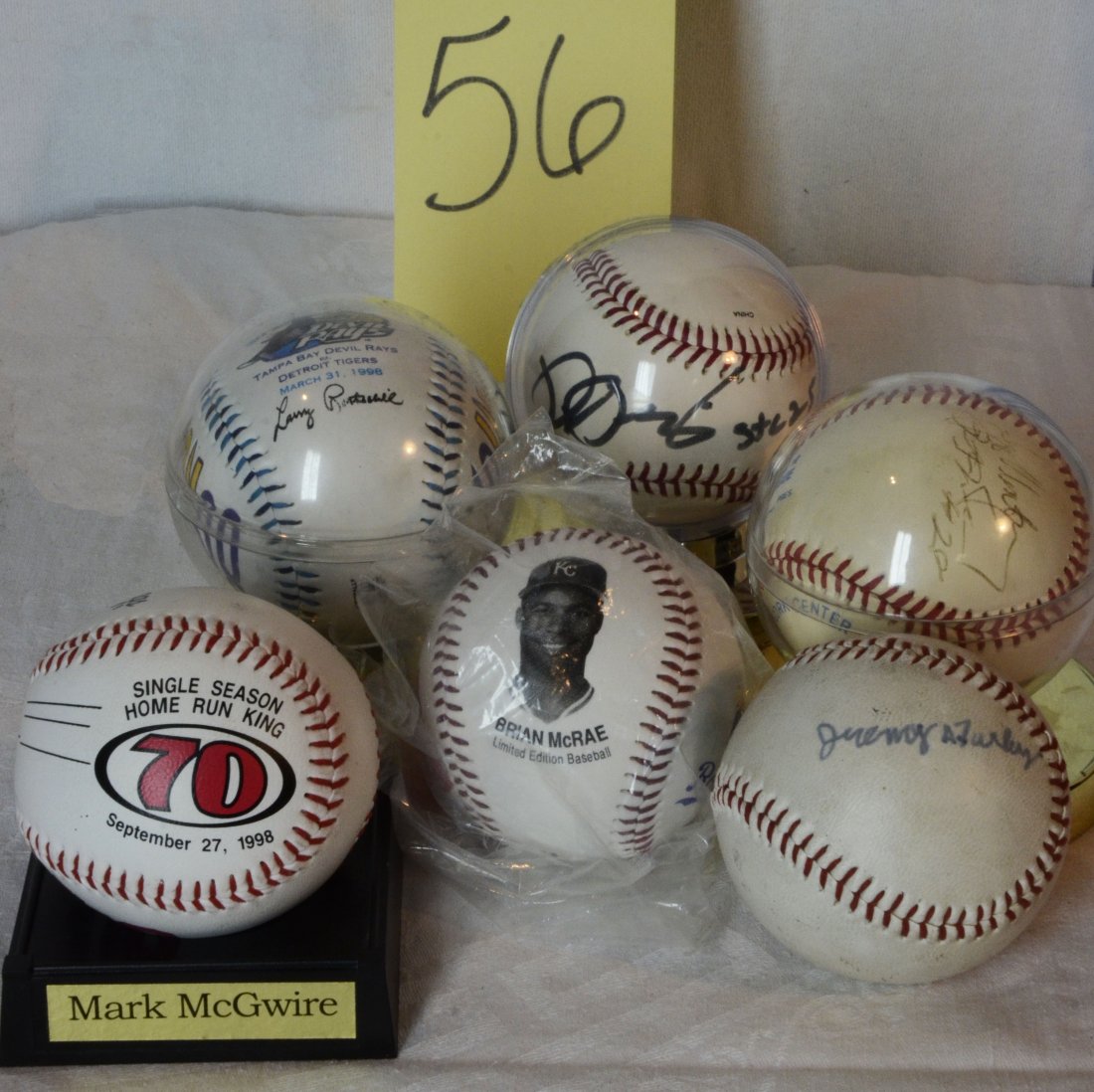 Multiple Souvineer Baseballs: Includes Mark McGwire, Brian McCrae, Jeremy A Furley?, baseball with unknown signature #28, Devil Rays inaugural season 1998 opening day in plastic holder - Devil Rays vs Detroit Tigers, Babe Ruth Lea