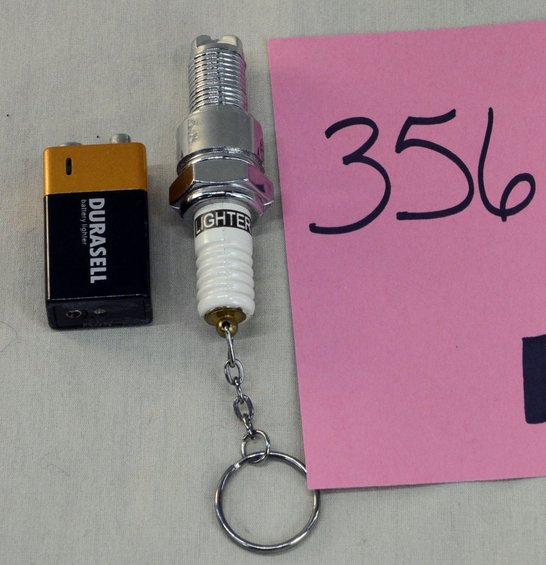 Durasell & Spark Plug Shaped Lighters: Cigarette lighters - Durasell in battery shape and auto spark plug shaped lighters.