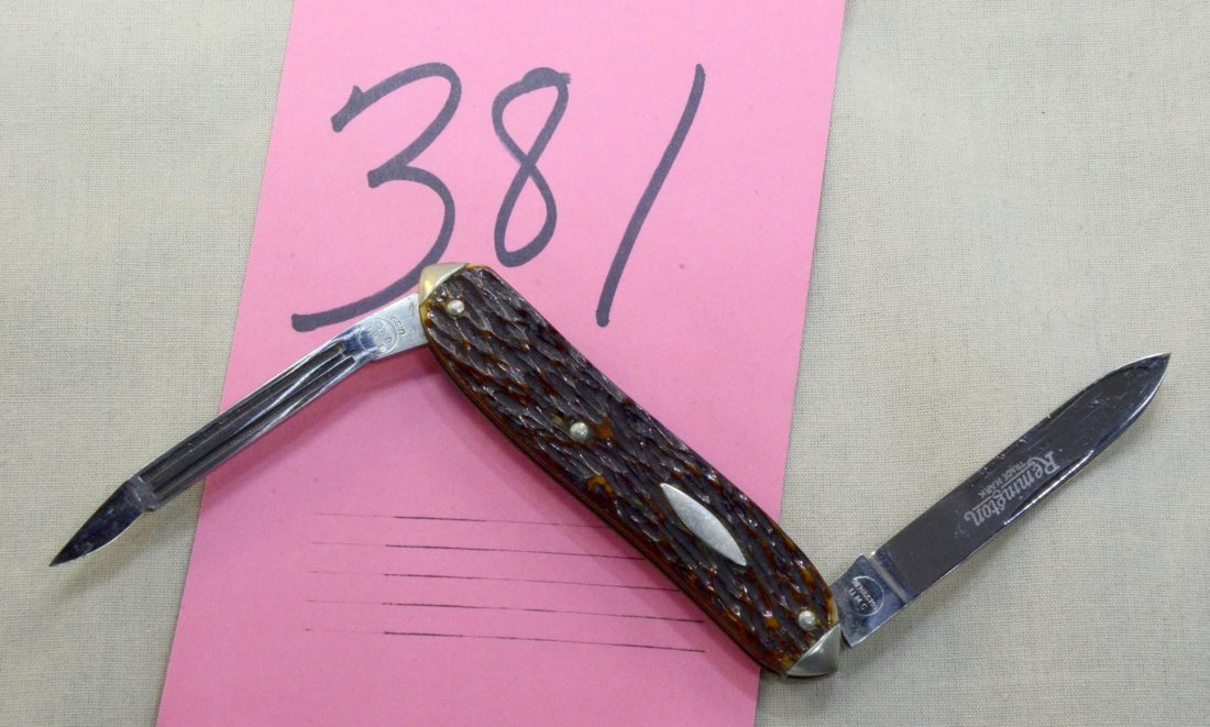 Remington Pen Knife #R6243: Remington "everyman's knife", vest pocket pen knife, stag handle, crocus polished cleaning blade and drop point etched blade, milled brass lining, nickel silver tips, 3.5" closed length.