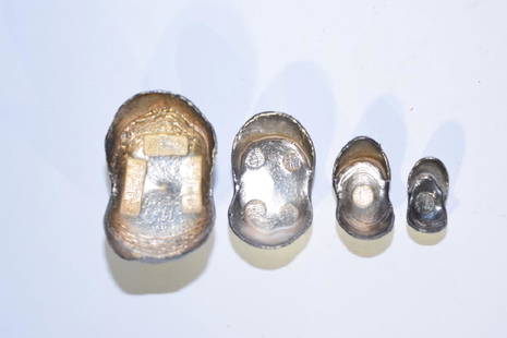 Set of Four Chinese Silver Ingots: Set of four Chinese silver ingots. 2.75in. Age wear.