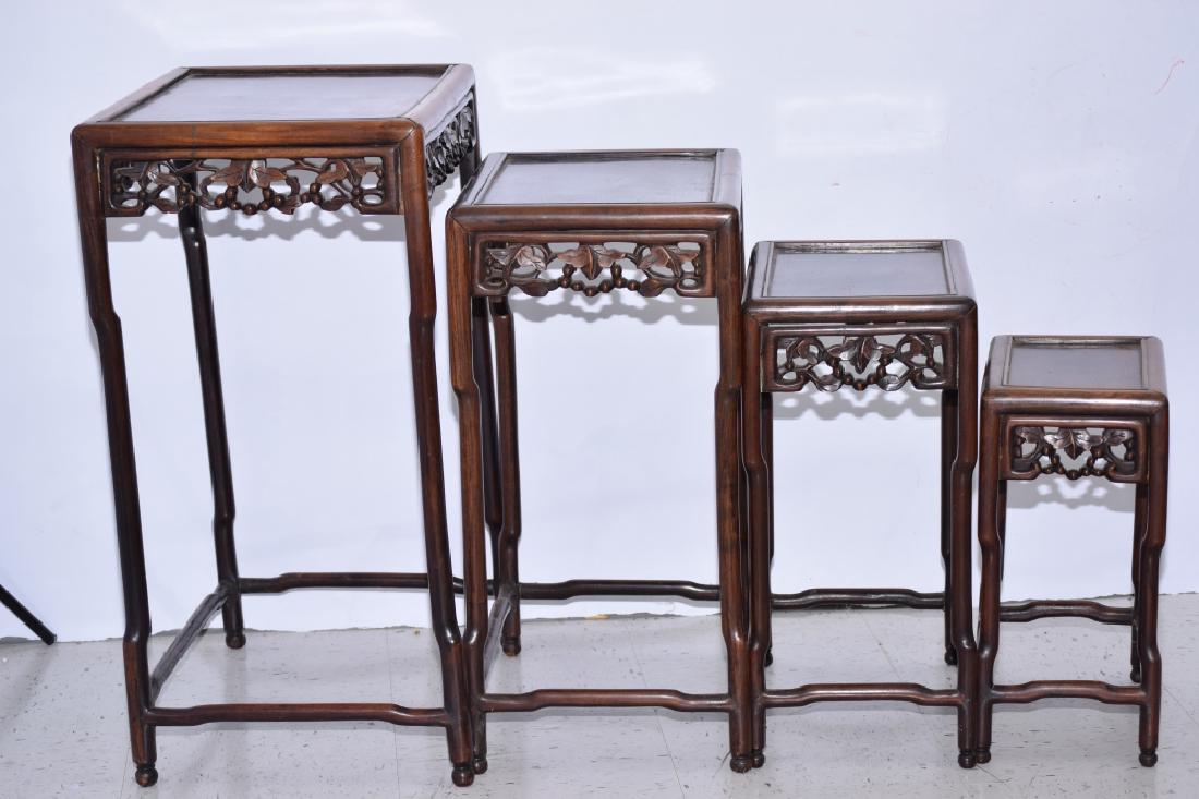 Set of Four Qing Chinese Hongmu Nesting Tables: Set of four Qing Chinese hongmu nesting tables. 15in by 20.5in by 28in. Others size varies. Age wear.