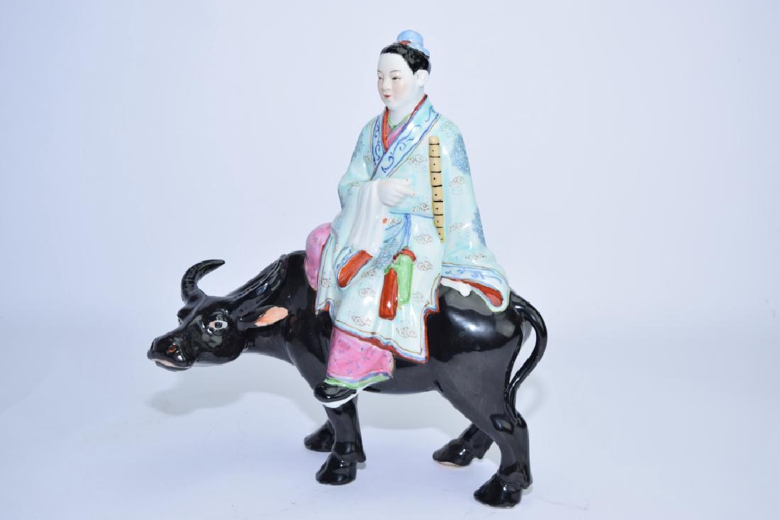 Chinese Famille Rose Boy Riding Ox: Chinese famille rose boy riding ox. 12in. Age wear.