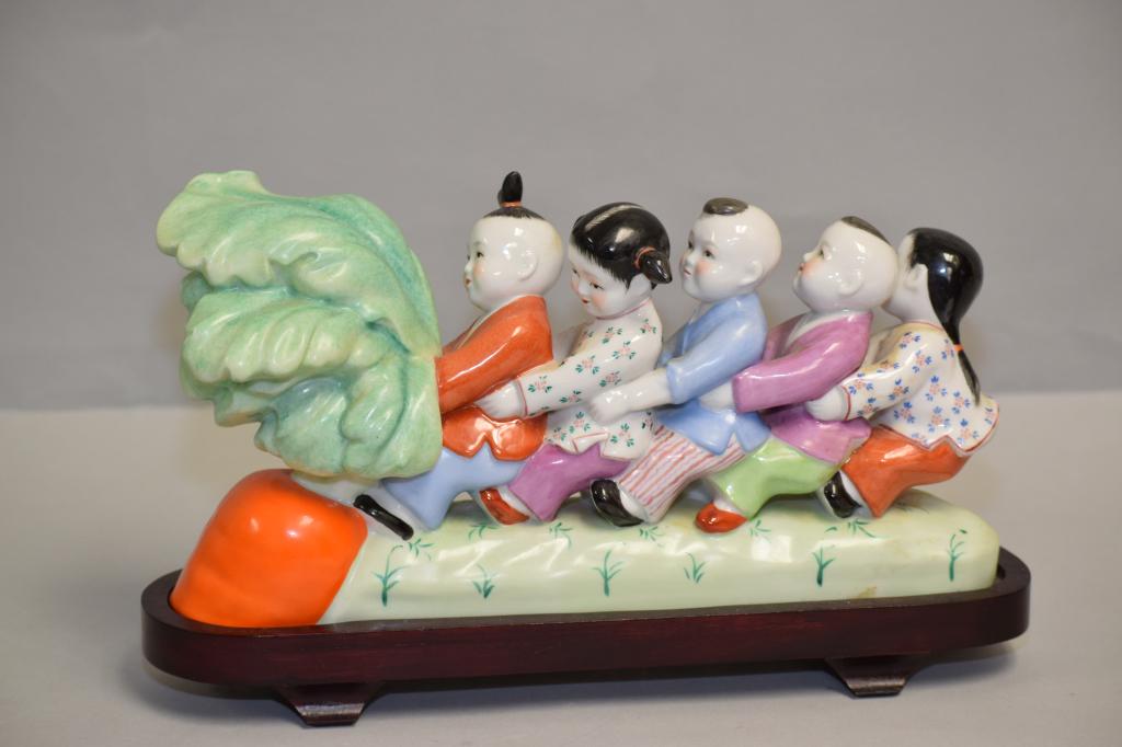 1950-70s Chinese Porcelain Famille Rose Children: 1950-70s Chinese porcelain famille rose children picking carrot. 11.5in.