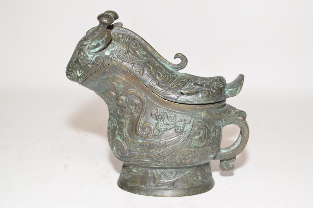 A Chinese Bronze Ritual Gong Ware: A Chinese Bronze Ritual Gong Ware, 7in by 6.75in