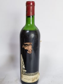 Bottle of Torn Label Red Bordeaux Wine