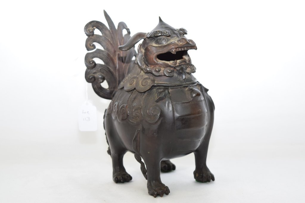 Qing Dynasty Chinese Bronze Foo Dog Incense Burner: Foo dog incense burner with opening head for incense placement.. H: 9.5in, L: 7.5in.