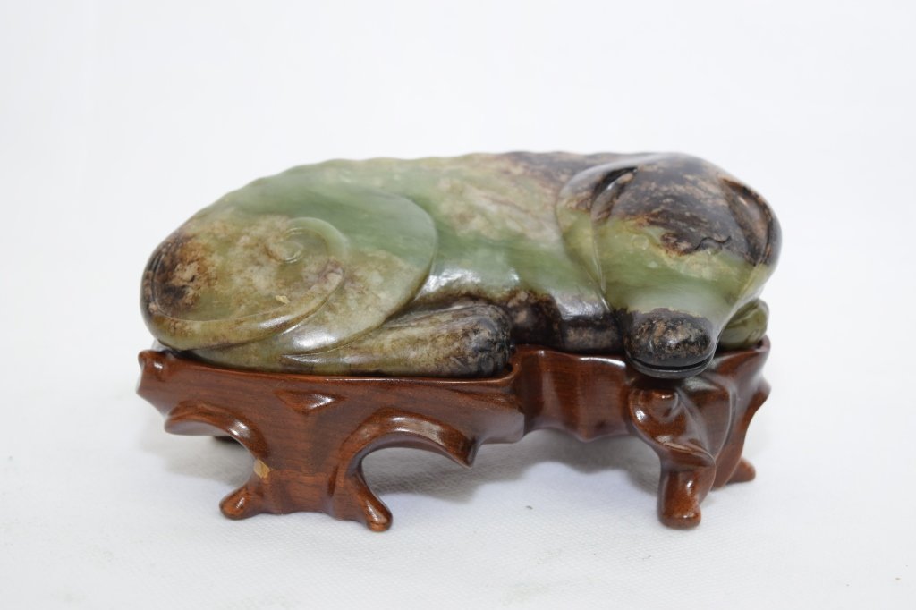 Late Ming-Qing Dynasty Chinese Jade Carved Dog: Late Ming to Early Qing dynasty Chinese jade carved dog in a curled position. L: 6 1/8in, W: 3.5in, H: 1.75in.