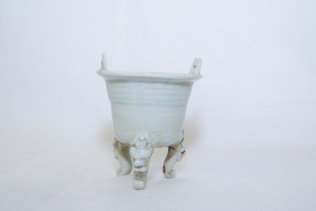 Yuan-Ming Dynasty Chinese Celadon Incense Burner: Beautiful three-footed Chinese celadon incense burner with ears. D: 3.75in, H: 4.5in.
