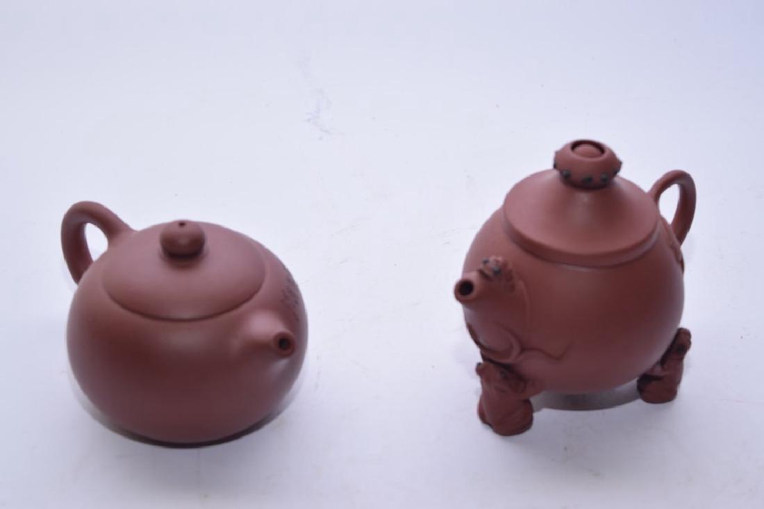 Two Chinese YiXing ZiSha Teapots: Two Chinese yixing zisha teapots. 3.25in & 4.5in. Age wear.