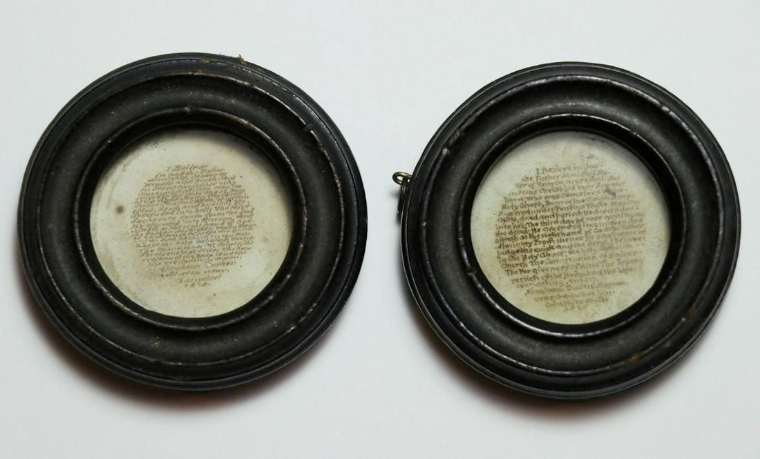 Microcalligraphy, Apostles Creed, a Pair: Two pieces of microcalligraphy, circa 19th century. Both are manuscript copies of the Apostles Creed, beginning, "I believe in God, the Father Almighty…." Each mounted behind glass in circular woode
