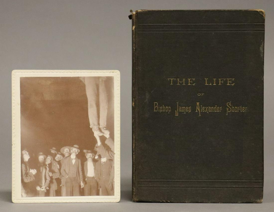 [Racism, African Americana]: Lot includes a photograph of a lynching, mounted on card and captioned on rear, "Citizens of Marshall Mo. Lynching a negro April 28th 1900. Crime â€“ Shooting the Sheriff's wife." 4.75" x 3.75". 