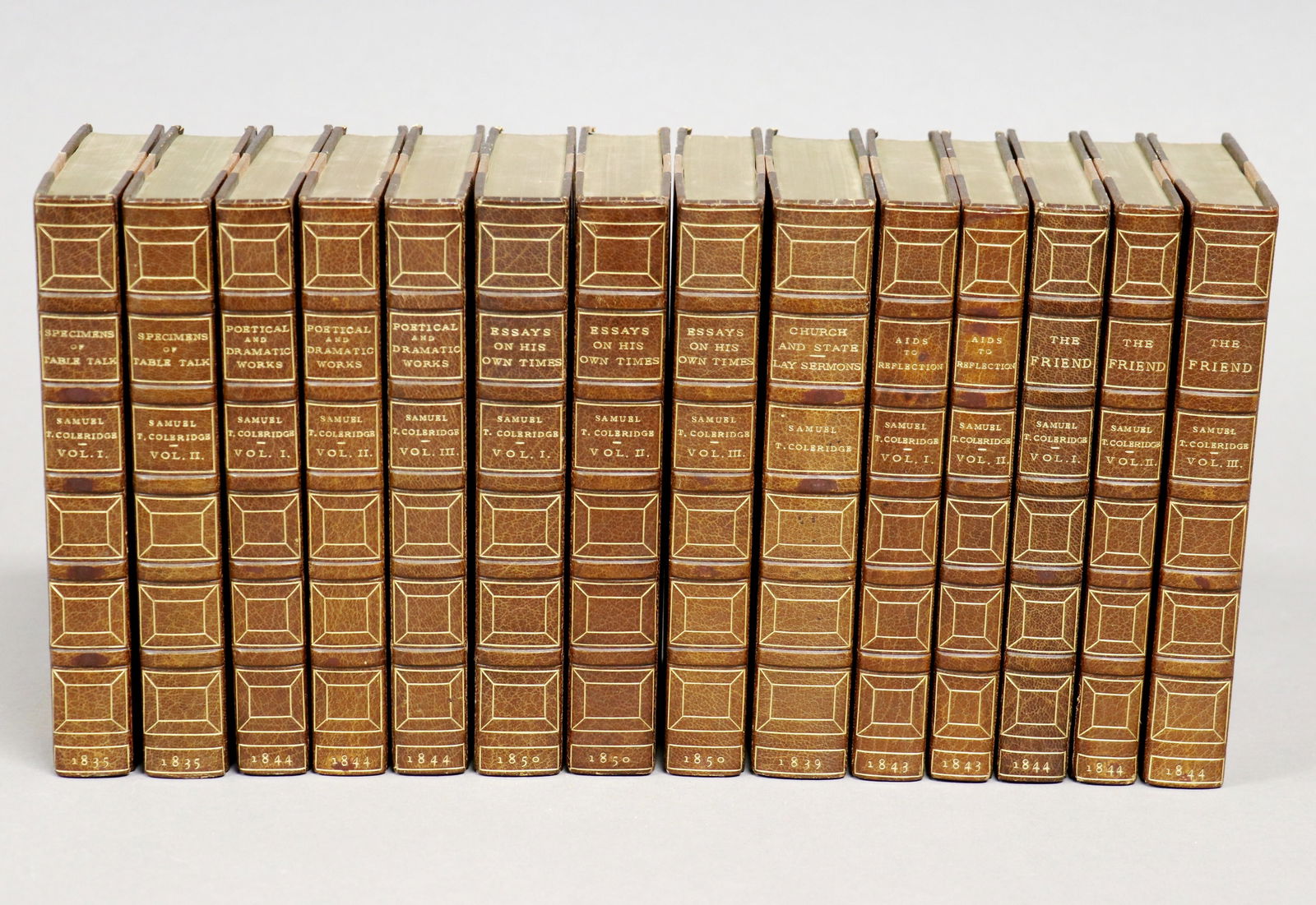 [Bindings, Pickering, Coleridge]: COLERIDGE, SAMUEL TAYLOR. [Works]. London: William Pickering (and John Murray, for Table Talk), 1835–1850. Together 14 volumes 6.5" x 4". Finely bound by Hatchard's in 1.2 morocco over cloth, t.e.g.