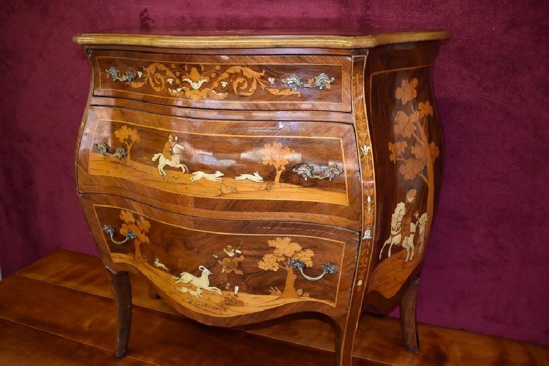 19th Century Italian Inlaid Bombe Commode: 19th Century Italian Inlaid Bombe, three drawer commode, the shaped top above a conforming case bone inlaid throughout with hunting scenes. H: 33” W:35” D:16”
