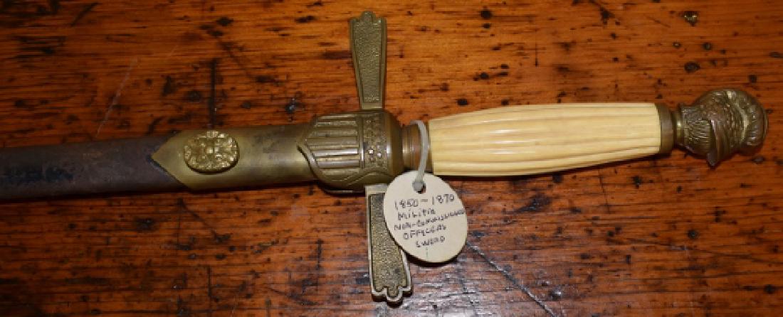 Confederate Militia Non-Commissioned Officers Sword: Confederate Militia Non-Commissioned officers Sword & Scabbard, 1850-1870, The Sword with a brass helmet Pommel, Bone grip and shield guard. Length: 34"