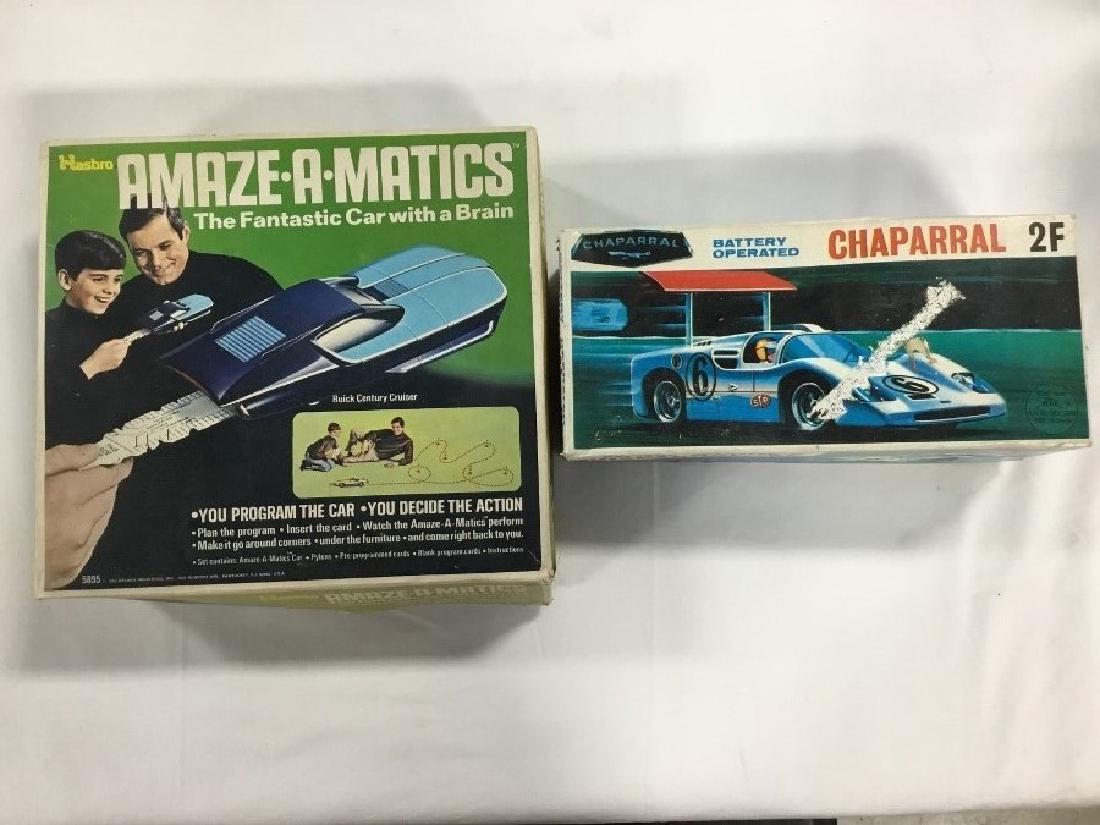 Lot of 2 1960s Toys: Hasbro Amaz a Matics, the fantastic car with the brain. Battery operated Chaparral 2F race car, original boxes. VG for age and use.