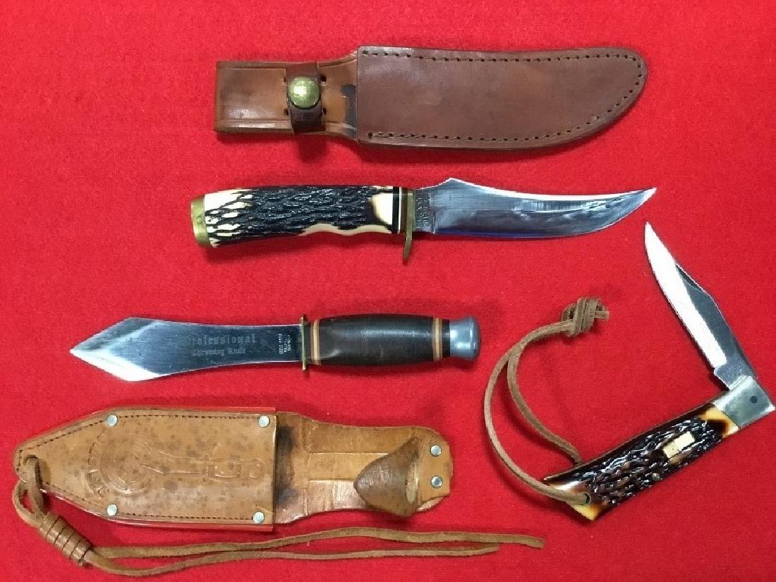 Lot of 3 Knives: Schrade fixed blade number 498 with sheath, good used condition. Edgemark, professional throwing knife with sheath good used condition. Cam-lok number 7. VG condition.