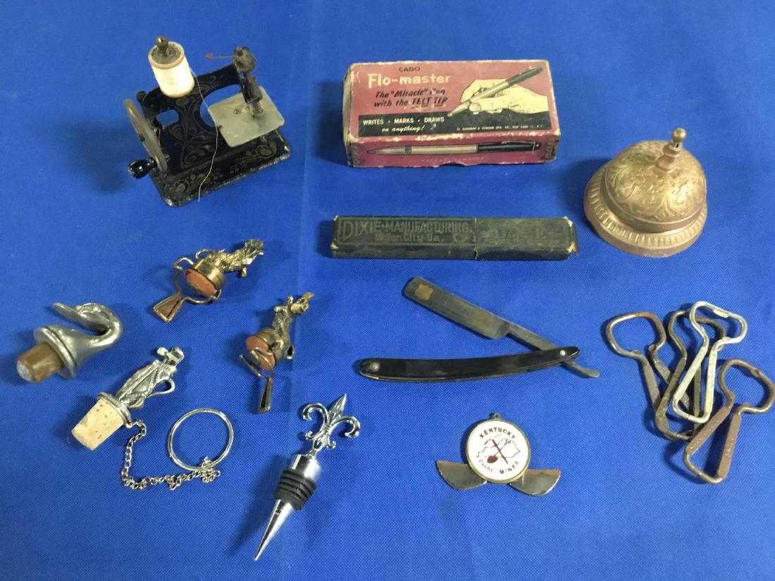 Lot of vintage collectibles.: Brass room service bell, Flo Master pen, straight razor, Kentucky Coal Miner Knife, 5 wine bottle stoppers, mini sewing machine, 4 bottle openers. All in good used found condition.