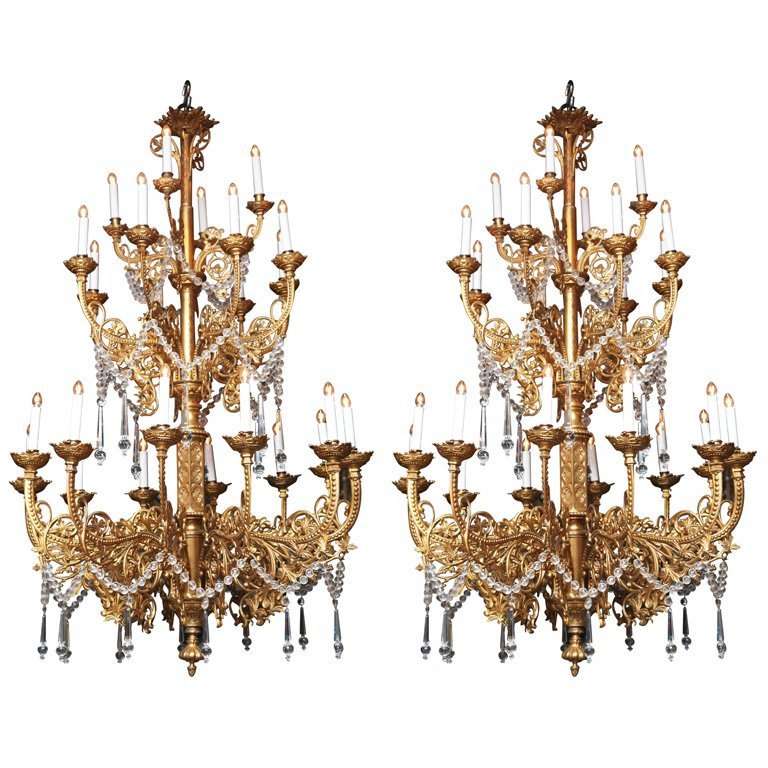 Pair of 19th Century Gilt Bronze Gothic Chandeliers: Pair of 19th Century Gilt-Bronze and Crystal 24-Light Gothic Chandeliers. H: 57" D: 36"