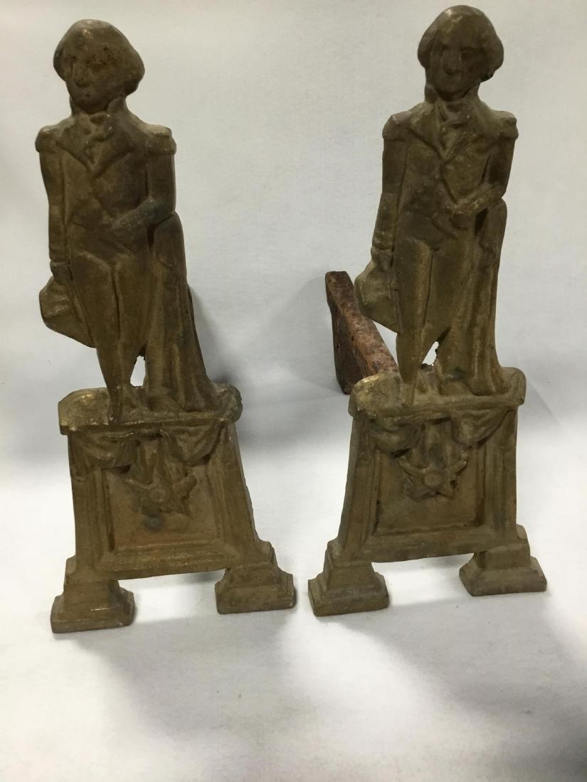 George Washington Cast Bronze Pair of Andirons: Standing General holding his hat, leaning on a draped pedastal, raised on a base with drapery above star. 20 Inches T.
